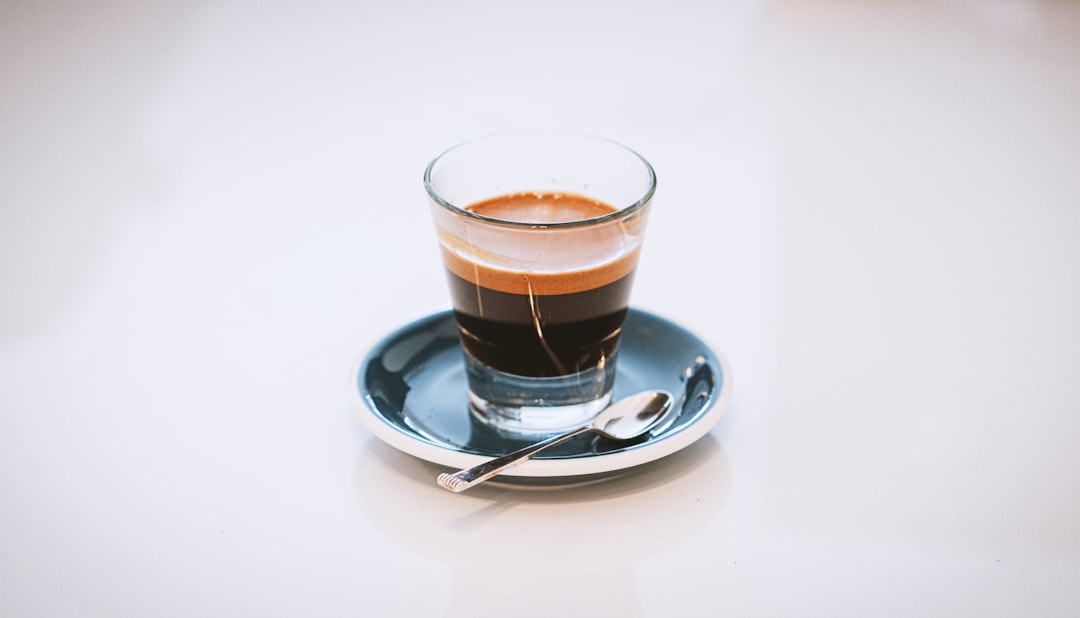 Close-up of rich, tiger-striped crema on a shot of espresso made with best beans for espresso blends